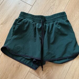 Green and black YPB shorts
